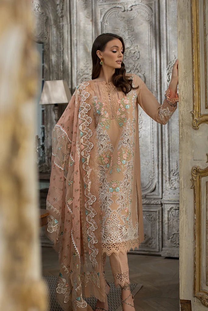 Model in a delicate Sobia Nazir DESIGN 4B lawn dress, showcasing Pakistani elegance in the UK.