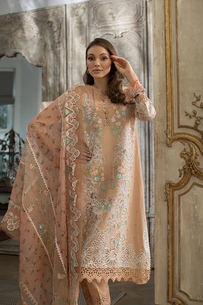 Model in a delicate Sobia Nazir DESIGN 4B lawn dress, showcasing Pakistani elegance in the UK.
