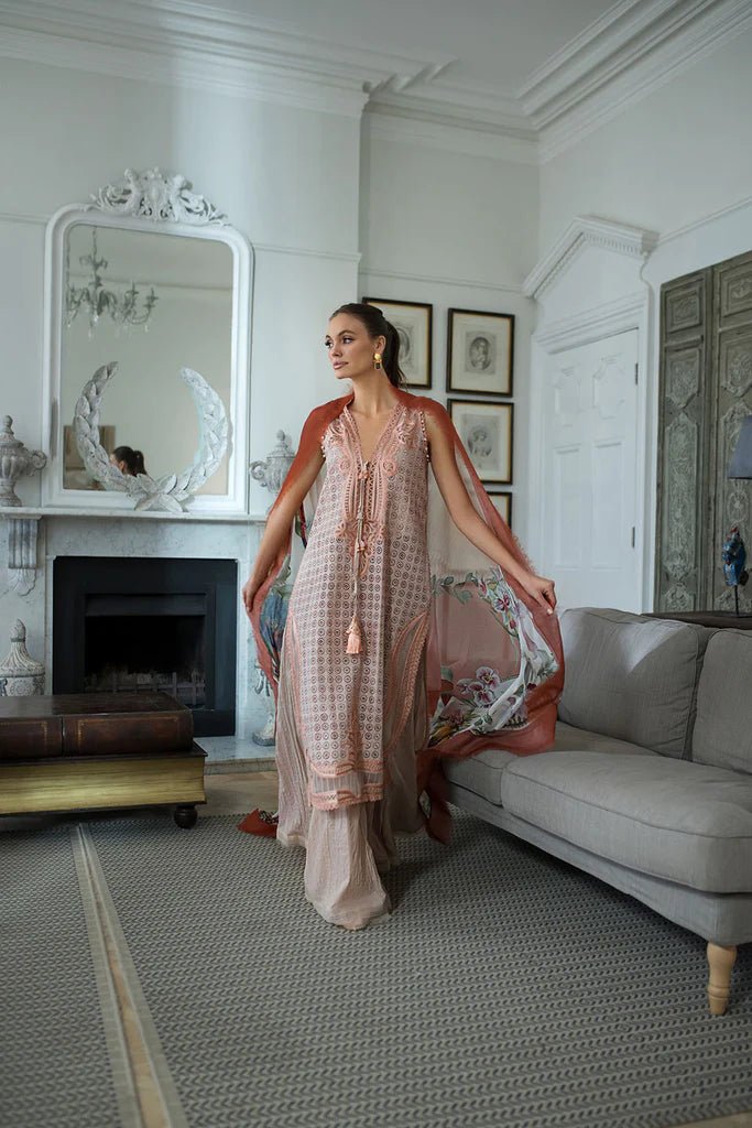 Model in Sobia Nazir DESIGN 5B, a pastel Pakistani lawn suit, UK's latest trend.