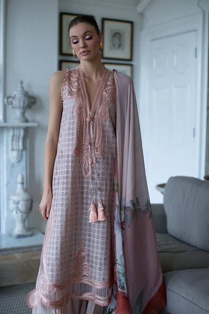 Model in Sobia Nazir DESIGN 5B, a pastel Pakistani lawn suit, UK's latest trend.