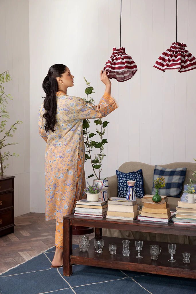 Model wearing Design 4A dress from Sobia Nazir's SN Basics '24 Unstitched collection. Shop Sobia Nazir and Pakistani clothes online in UK at Signature Labels.