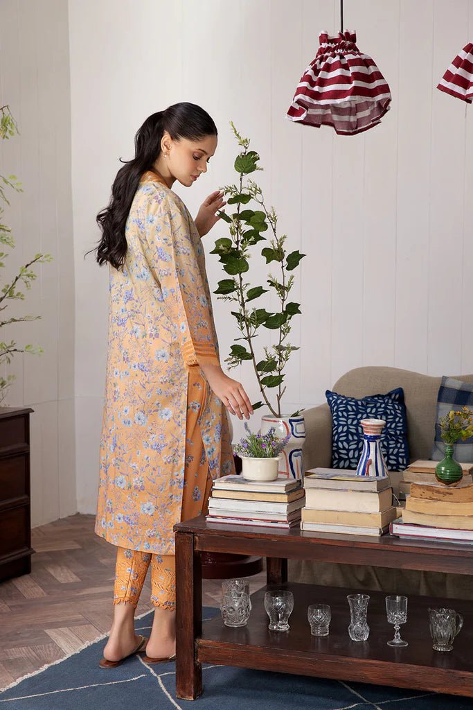 Model wearing Design 4A dress from Sobia Nazir's SN Basics '24 Unstitched collection. Shop Sobia Nazir and Pakistani clothes online in UK at Signature Labels.