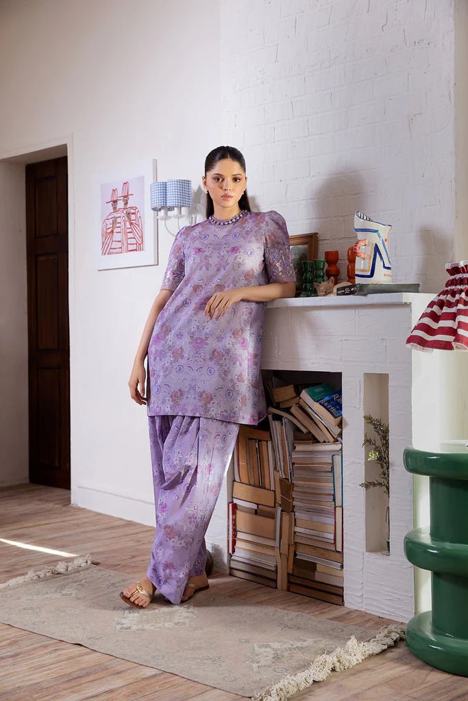 Model wearing Design 6B dress from Sobia Nazir's SN Basics '24 Unstitched collection. Shop Sobia Nazir for Pakistani clothes online in UK.