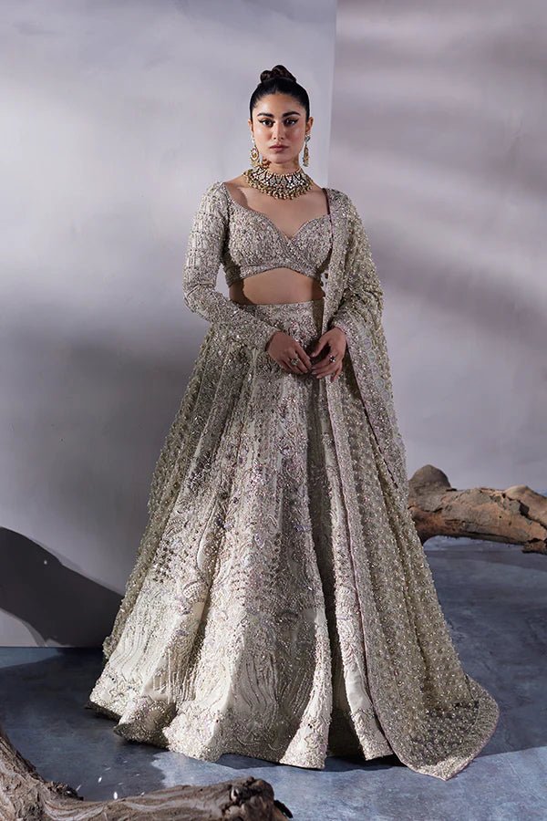 model wearing SORAYA LIVIA Pakistani bridal dress in UK, silver glittery lehenga