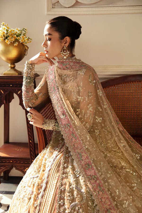 Model wearing IRINA, a gold and pink dress from Soraya's Lumene Festive '24 collection. Perfect for weddings, available online in the UK.