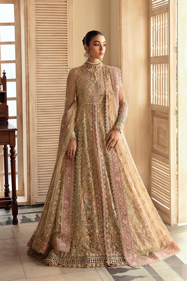 Model wearing IRINA, a gold and pink dress from Soraya's Lumene Festive '24 collection. Perfect for weddings, available online in the UK.