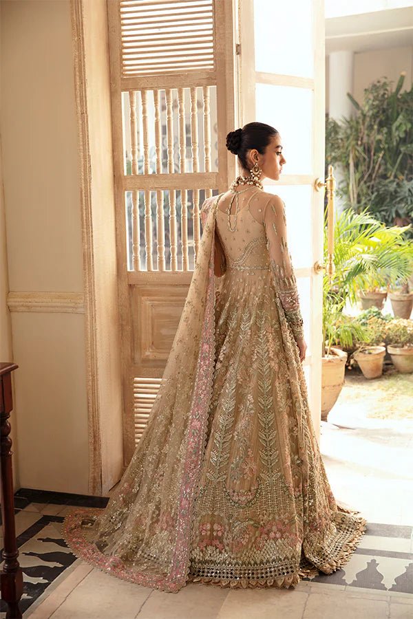 Model wearing IRINA, a gold and pink dress from Soraya's Lumene Festive '24 collection. Perfect for weddings, available online in the UK.