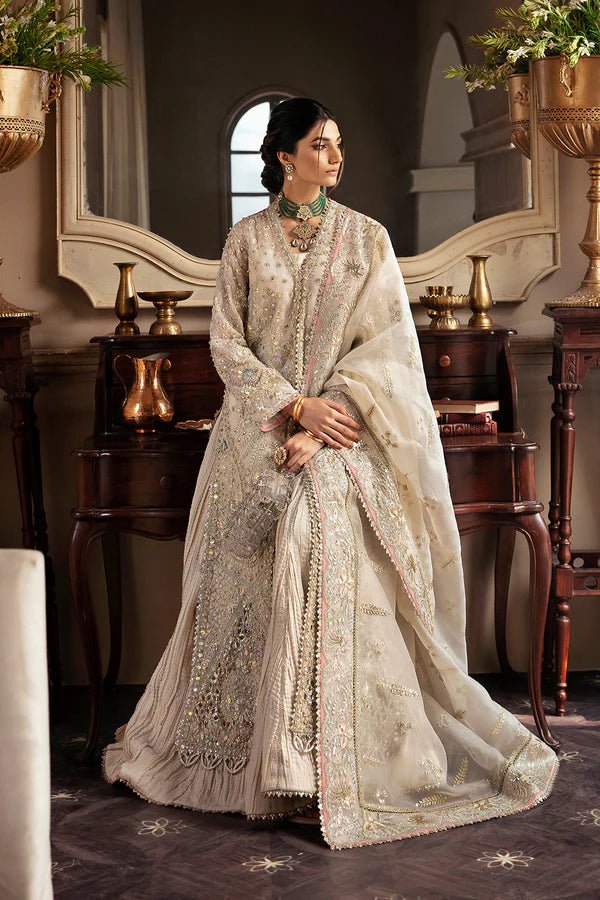 Model wearing a luxurious MIEL dress in silver by Soraya from the Lumene Festive '24 collection. Ideal for weddings and available online in the UK.
