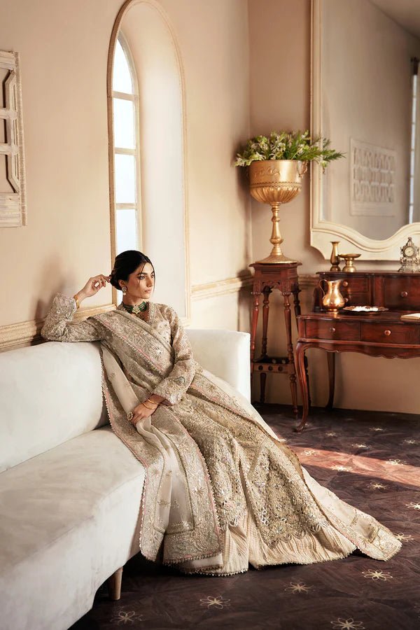Model wearing a luxurious MIEL dress in silver by Soraya from the Lumene Festive '24 collection. Ideal for weddings and available online in the UK.