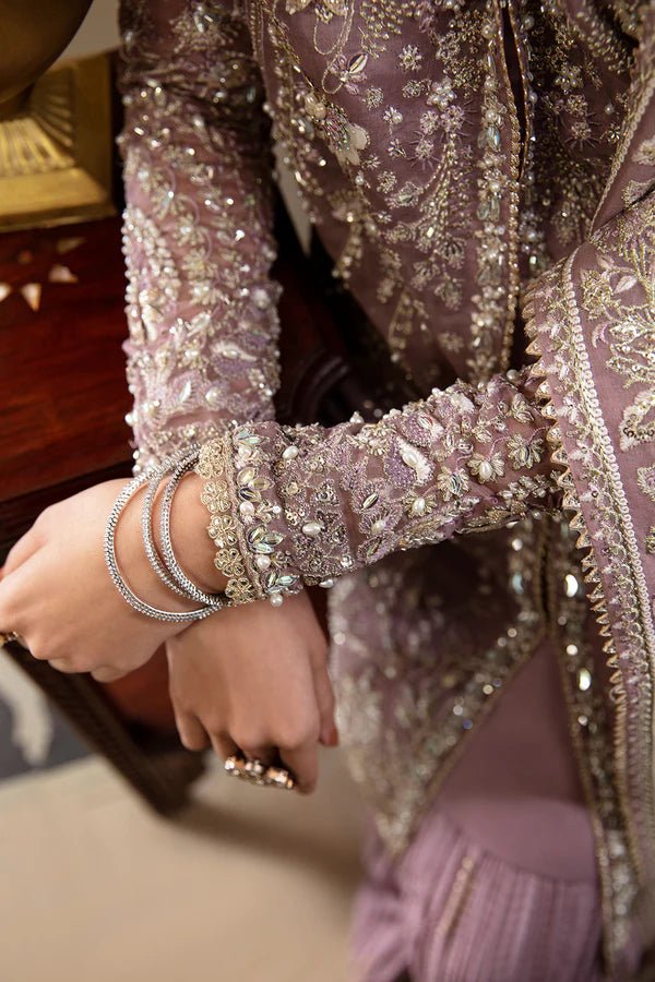 Model wearing a lavender Sehr dress from Soraya's Lumene Festive '24 collection. Perfect for weddings, shop Pakistani clothes online in the UK.