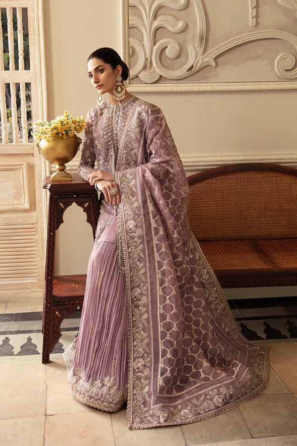 Model wearing a lavender Sehr dress from Soraya's Lumene Festive '24 collection. Perfect for weddings, shop Pakistani clothes online in the UK.