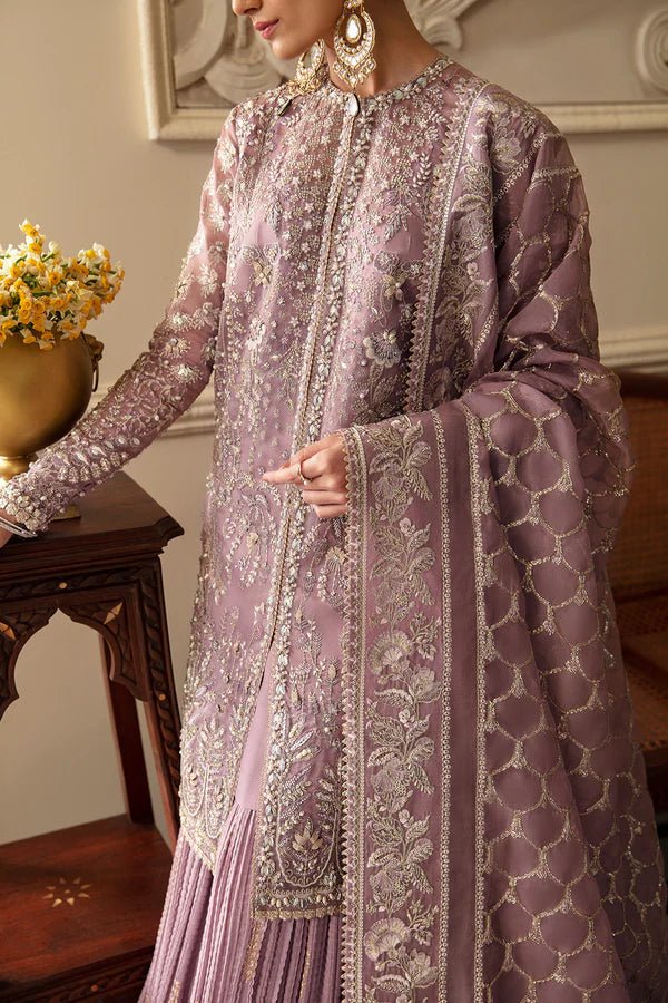 Model wearing a lavender Sehr dress from Soraya's Lumene Festive '24 collection. Perfect for weddings, shop Pakistani clothes online in the UK.