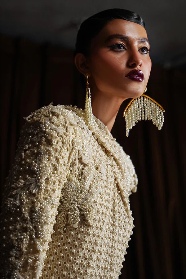 Model wearing Suffuse OPAL dress, a chic ensemble from Luxury Pret '24. Pakistani couture online in UK.