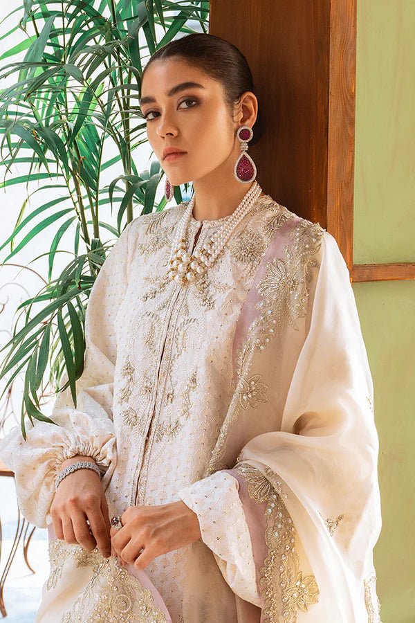 Model showcasing Suffuse Dainty Ivory dress, a luxurious pick from Luxury Pret Aura collection. Perfect for Pakistani wedding clothes online in UK.