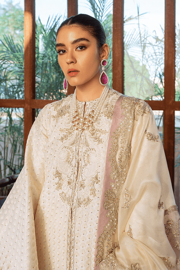 Model showcasing Suffuse Dainty Ivory dress, a luxurious pick from Luxury Pret Aura collection. Perfect for Pakistani wedding clothes online in UK.