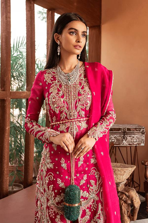 Model showcasing Suffuse Fuchsia Rose dress, a luxurious pick from Luxury Pret Aura collection. Perfect for Pakistani wedding clothes online in UK.