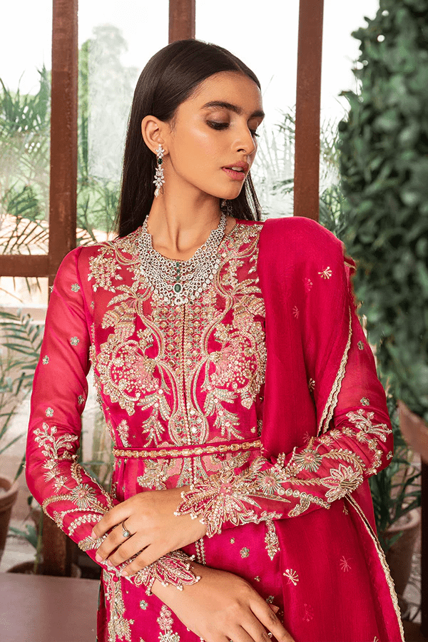 Model showcasing Suffuse Fuchsia Rose dress, a luxurious pick from Luxury Pret Aura collection. Perfect for Pakistani wedding clothes online in UK.
