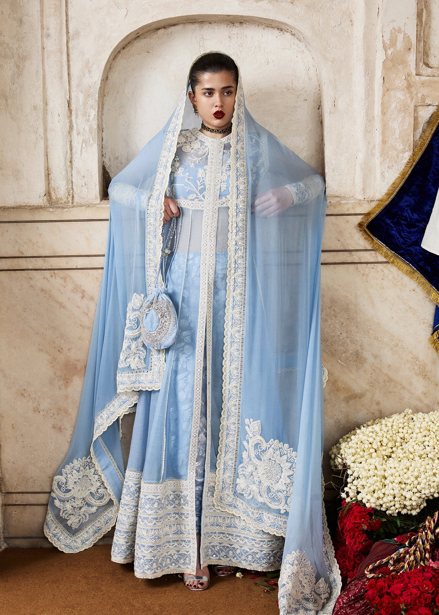 Model wearing Mehrabeen by Hussain Rehar in powder blue embroidered ensemble – Pakistani luxury pret available online in UK for festive wear.