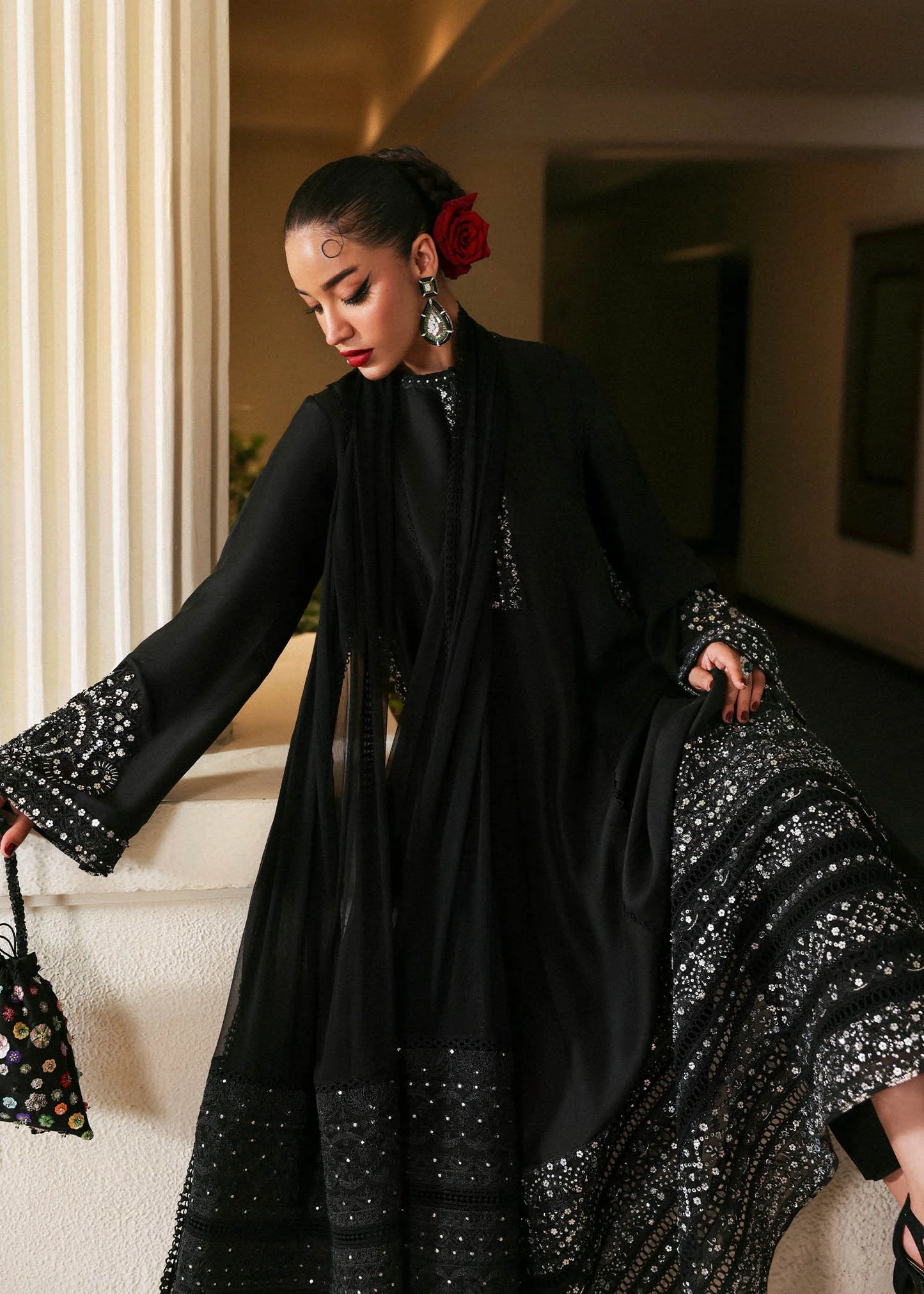 Model wearing black Noer dress by Hussain Rehar, Pakistani luxury pret available online in UK for festive celebrations.