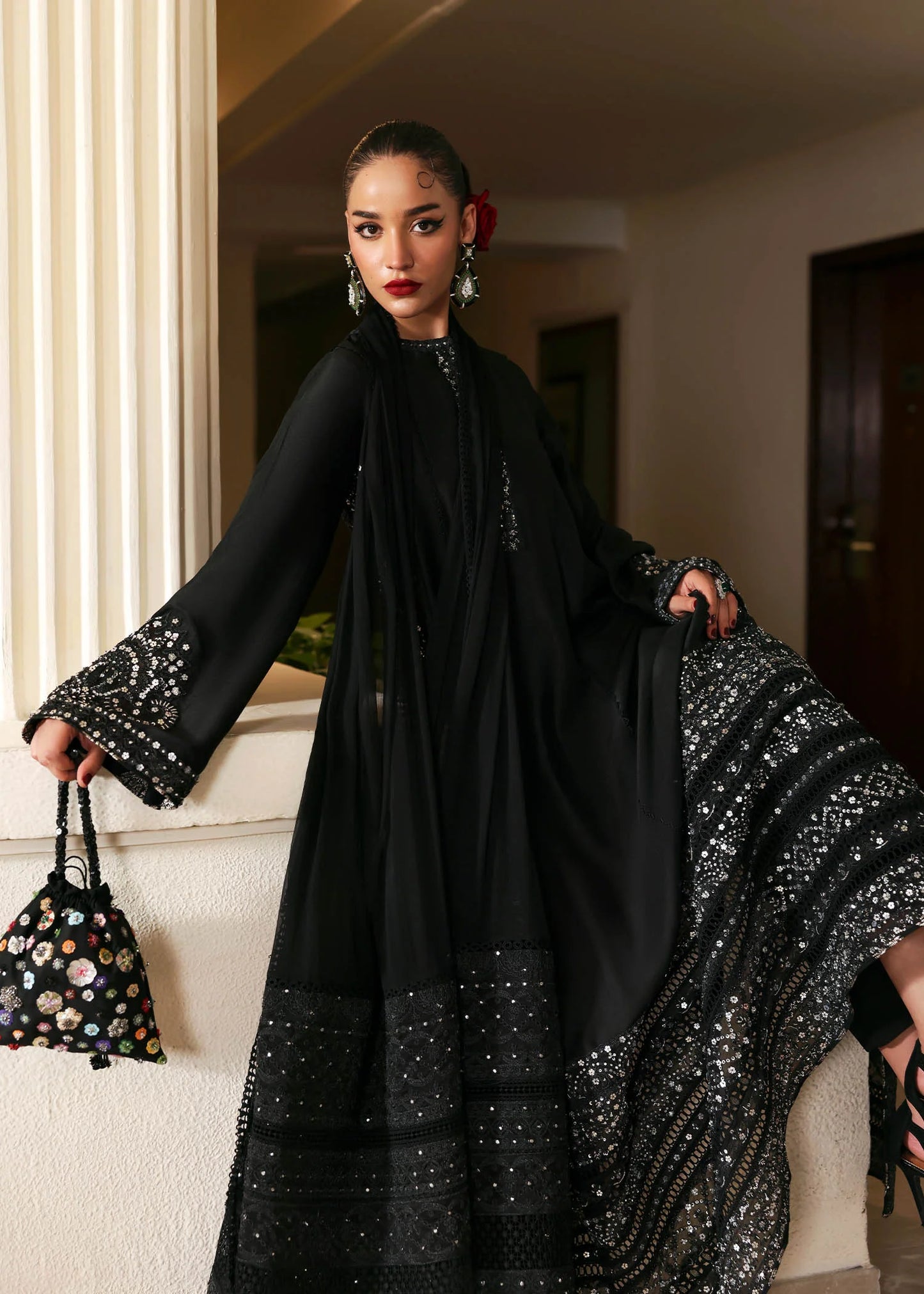 Model wearing black Noer dress by Hussain Rehar, Pakistani luxury pret available online in UK for festive celebrations.