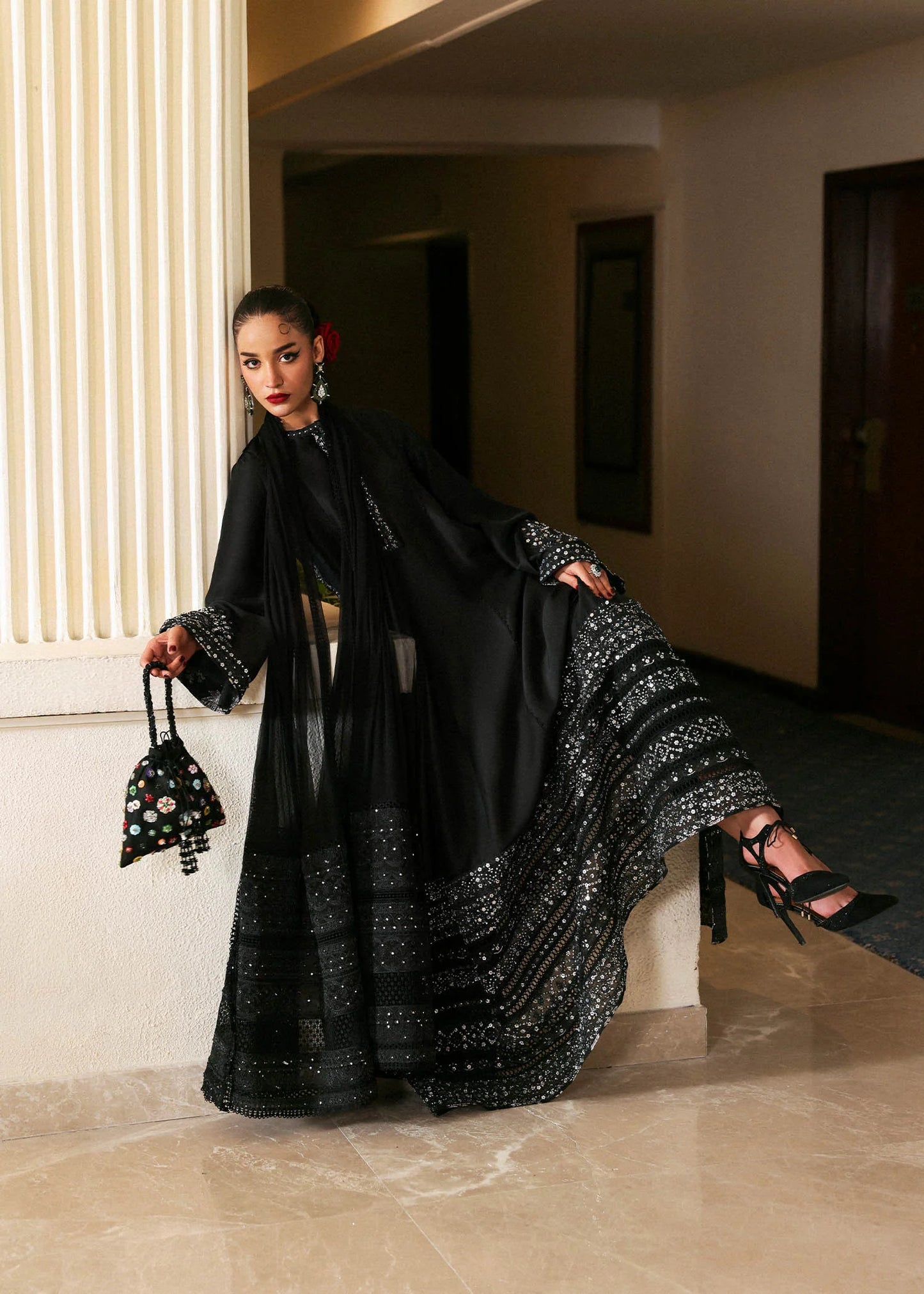 Model wearing black Noer dress by Hussain Rehar, Pakistani luxury pret available online in UK for festive celebrations.