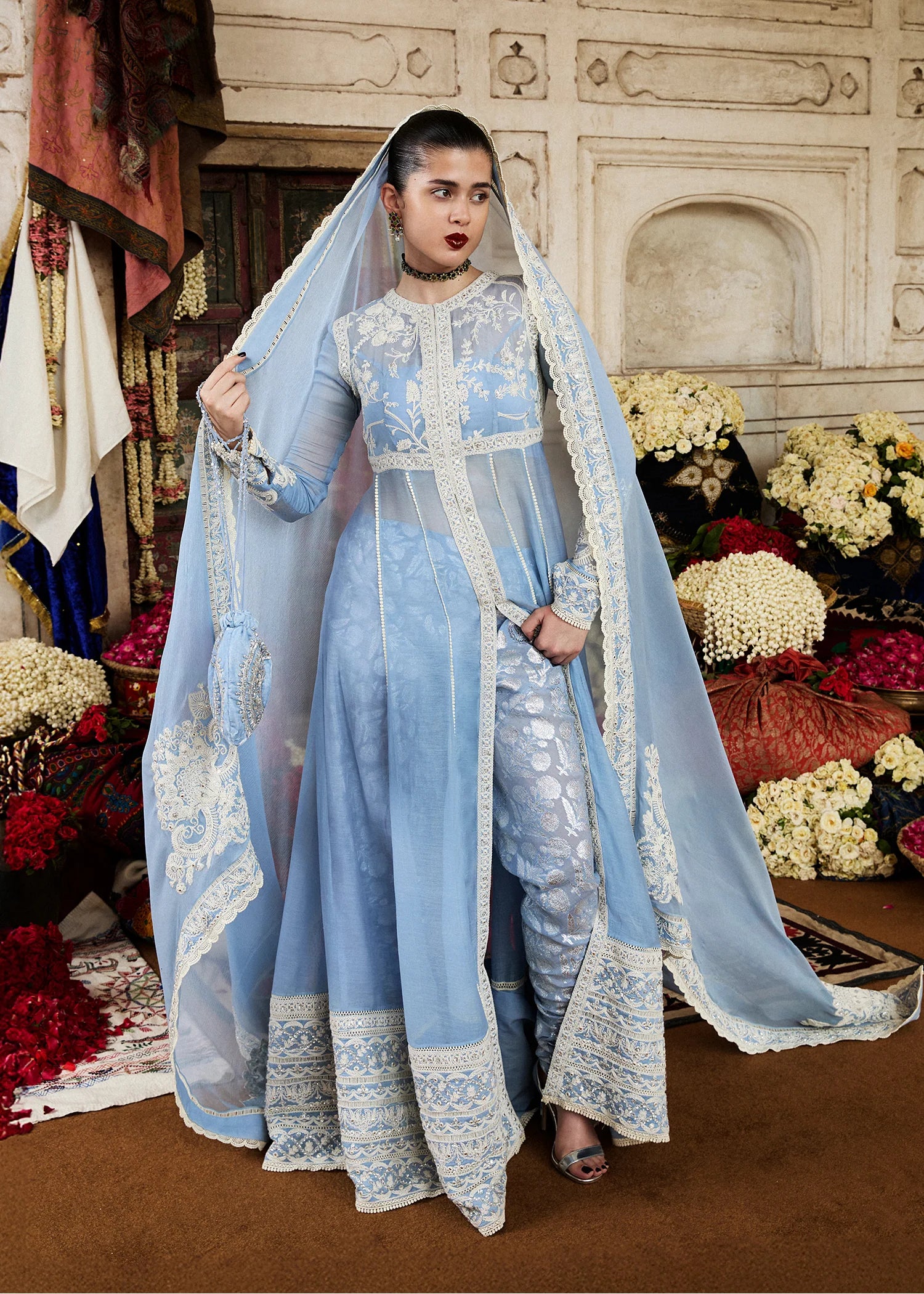 Model wearing Mehrabeen by Hussain Rehar in powder blue embroidered ensemble – Pakistani luxury pret available online in UK for festive wear.