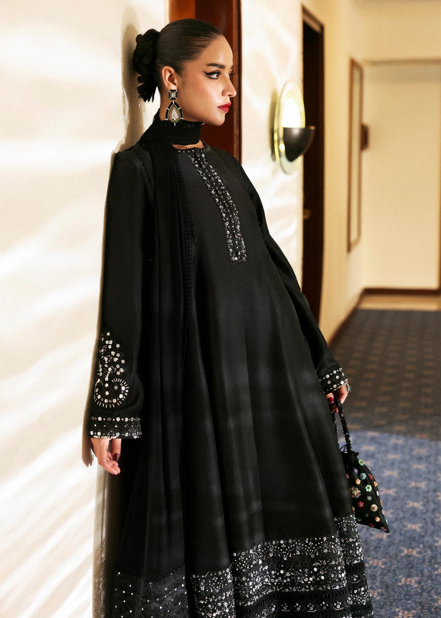 Model wearing black Noer dress by Hussain Rehar, Pakistani luxury pret available online in UK for festive celebrations.