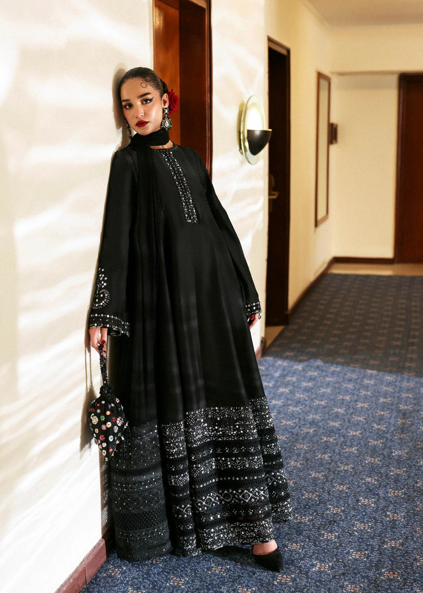 Model wearing black Noer dress by Hussain Rehar, Pakistani luxury pret available online in UK for festive celebrations.