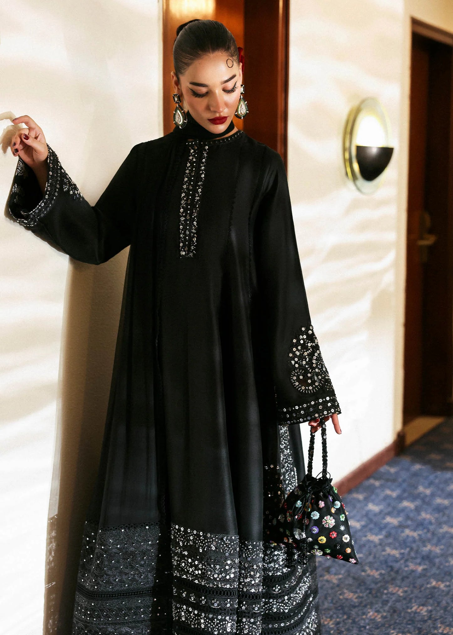 Model wearing black Noer dress by Hussain Rehar, Pakistani luxury pret available online in UK for festive celebrations.