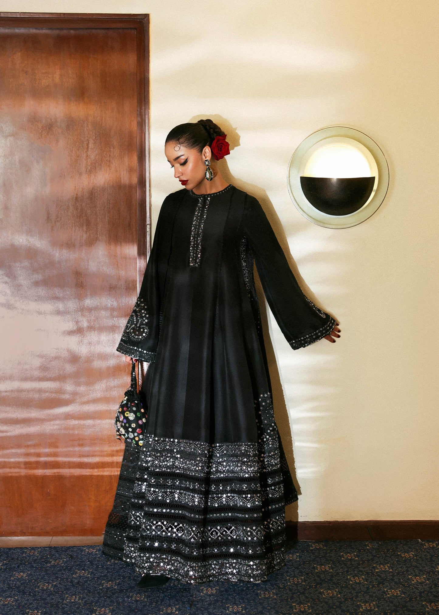 Model wearing black Noer dress by Hussain Rehar, Pakistani luxury pret available online in UK for festive celebrations.