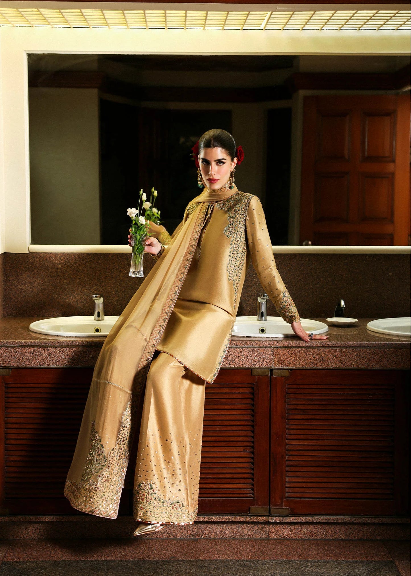 Model wearing gold Delune dress by Hussain Rehar, Pakistani luxury pret available online in UK for festive and wedding wear