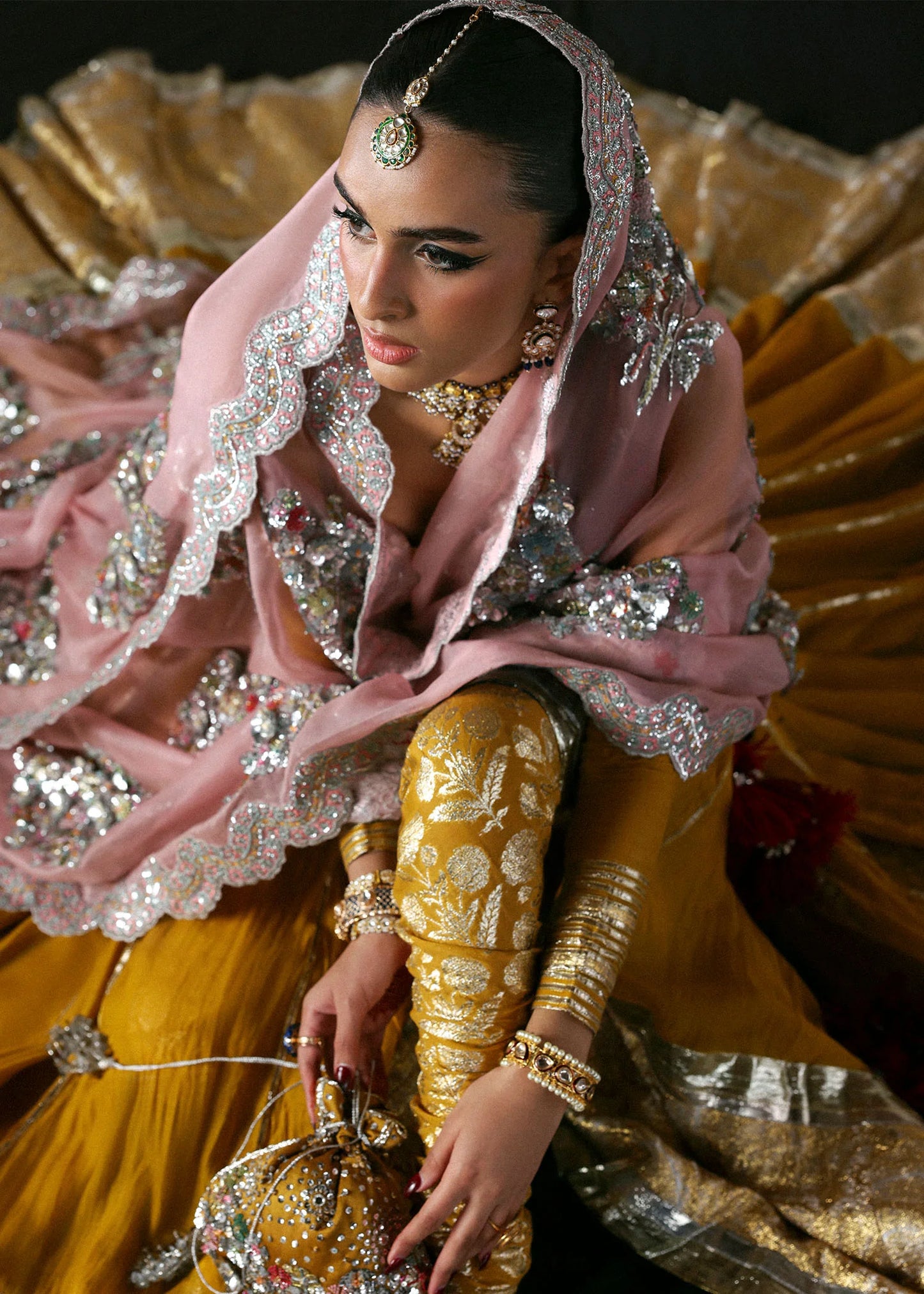 Model wearing Elika by Hussain Rehar in mustard and pink with heavy silver embellishments – exquisite Pakistani luxury pret outfit in UK.