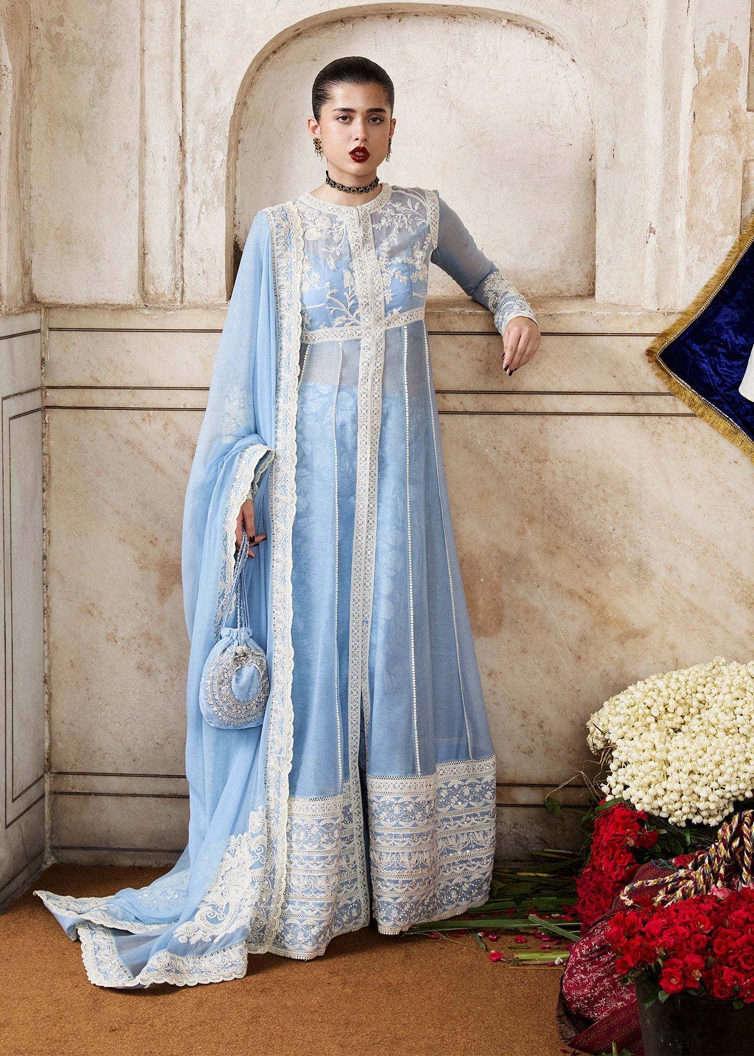 Model wearing Mehrabeen by Hussain Rehar in powder blue embroidered ensemble – Pakistani luxury pret available online in UK for festive wear.