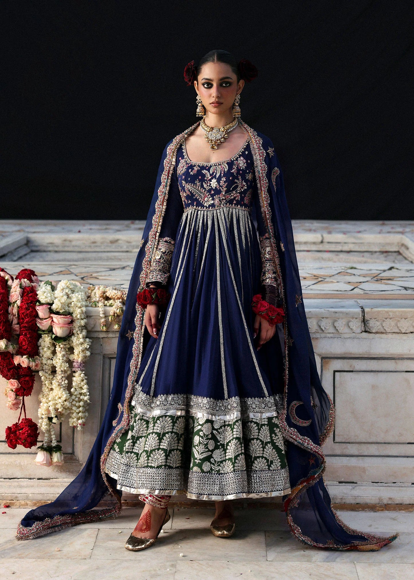 Model wearing Zarmina by Hussain Rehar in navy blue with intricate embroidery and green accents – elegant Pakistani luxury pret outfit in UK.