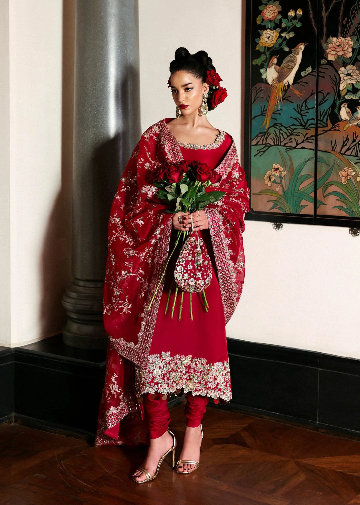 Model wearing deep red Zephira dress by Hussain Rehar, Pakistani luxury pret available online in UK for festive occasions