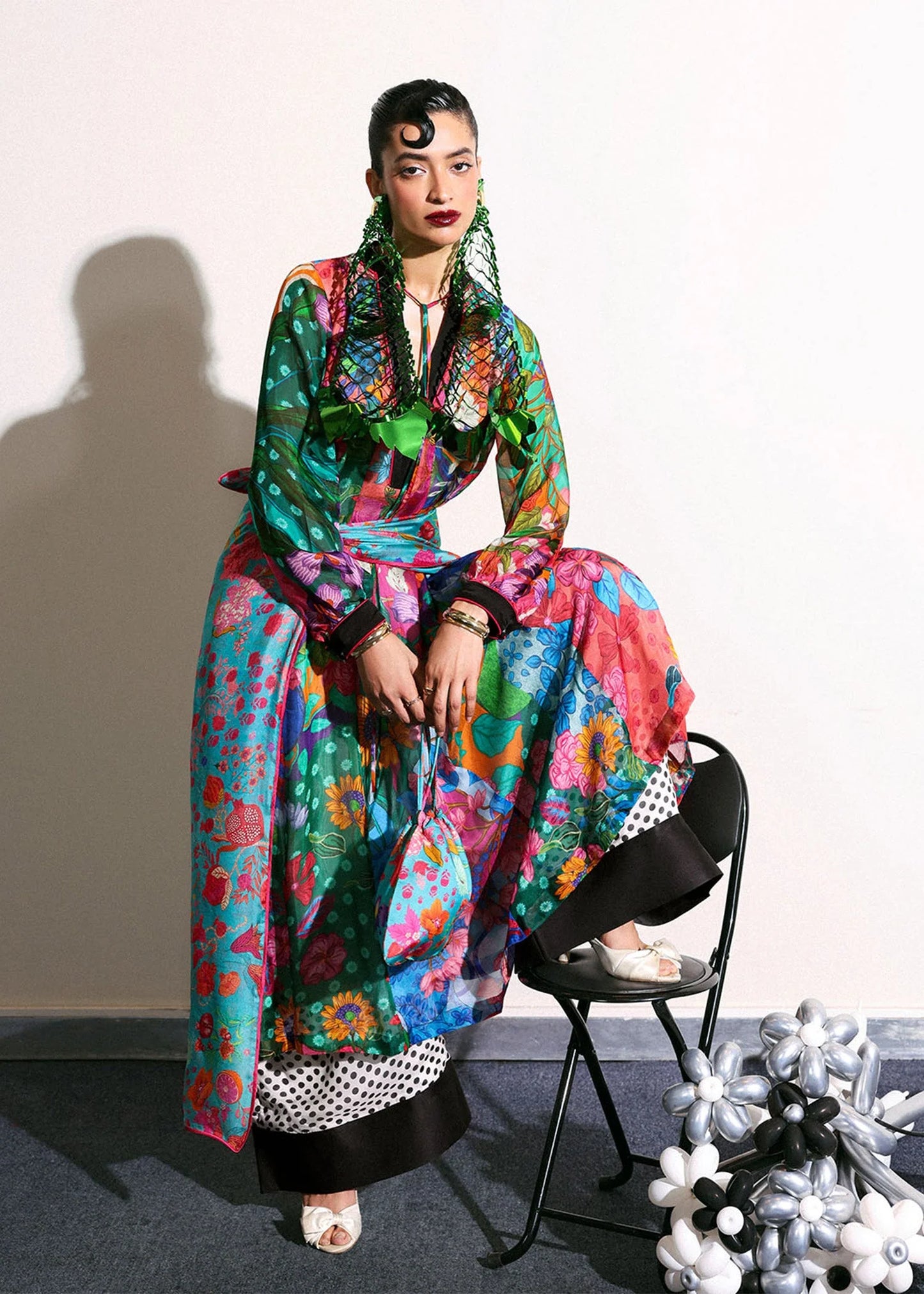 Model wearing multicolor floral Claret outfit with polka dot trousers from Hussain Rehar, ideal for Pakistani luxury pret in UK.