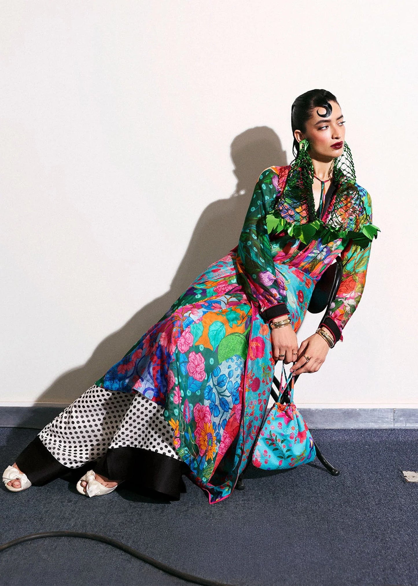 Model wearing multicolor floral Claret outfit with polka dot trousers from Hussain Rehar, ideal for Pakistani luxury pret in UK.