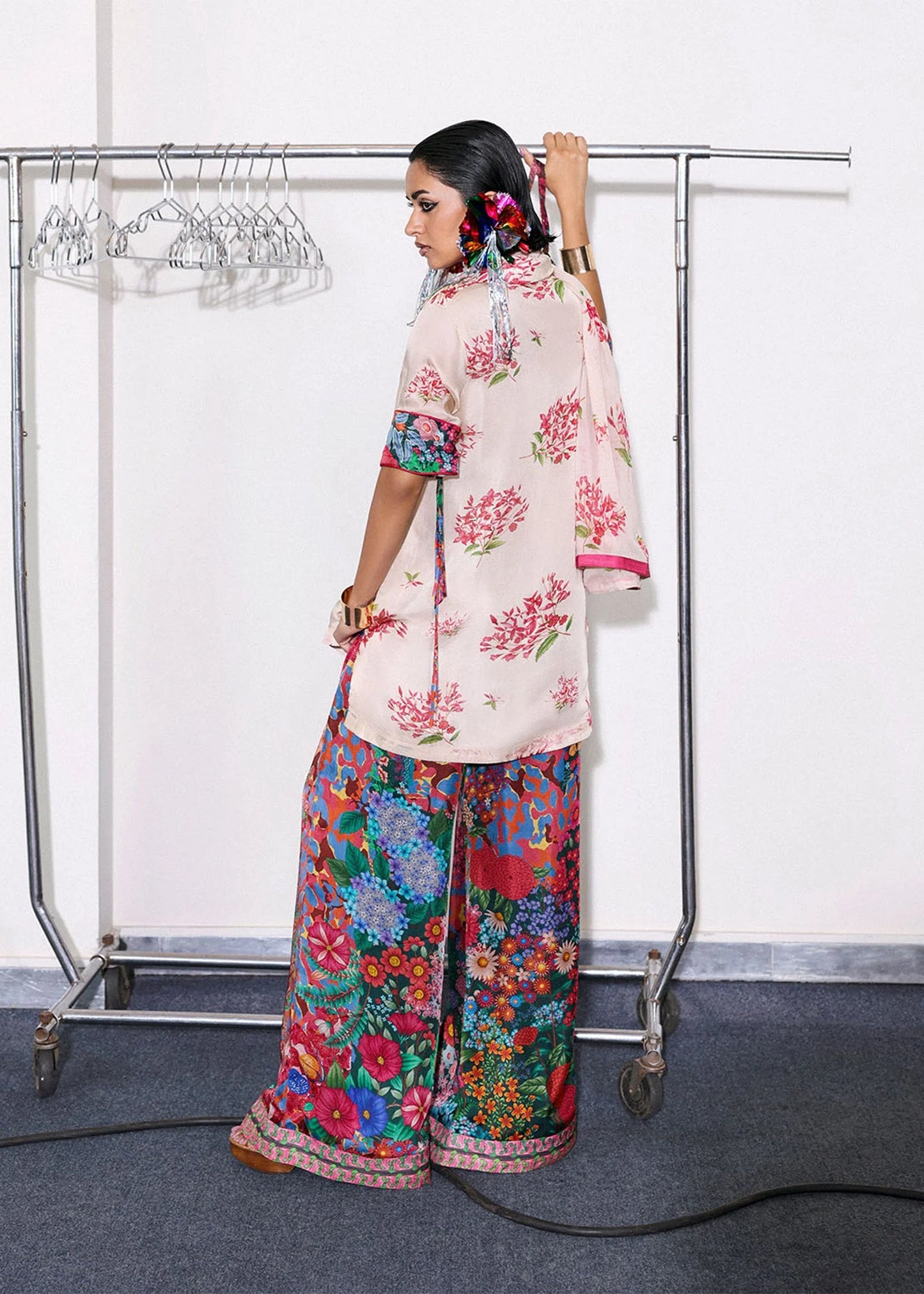 Model wearing blush pink and multicolor floral outfit from Hussain Rehar, perfect for Pakistani luxury pret and clothes online in UK.