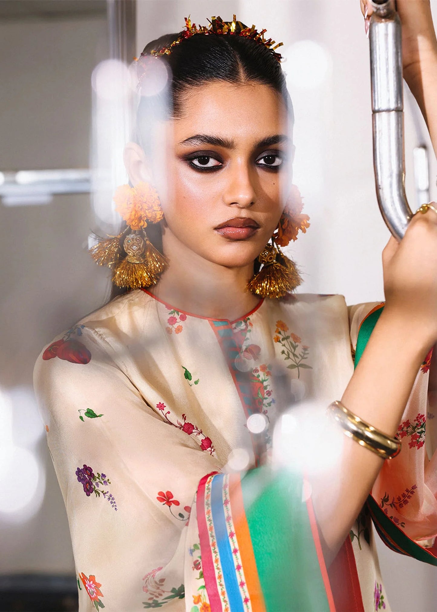 Model wearing cream multicolor Coraline outfit from Hussain Rehar with floral prints and green accents, perfect Pakistani luxury pret in UK.