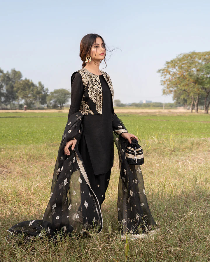 model wearing black dress by Faiza Saqlain, Pakistani luxury pret available online in UK for elegant Pakistani fashion