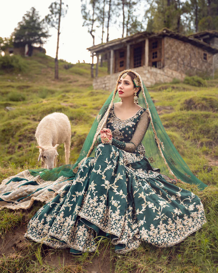 model wearing green dress by Faiza Saqlain, Pakistani luxury pret ideal for online shopping in the UK