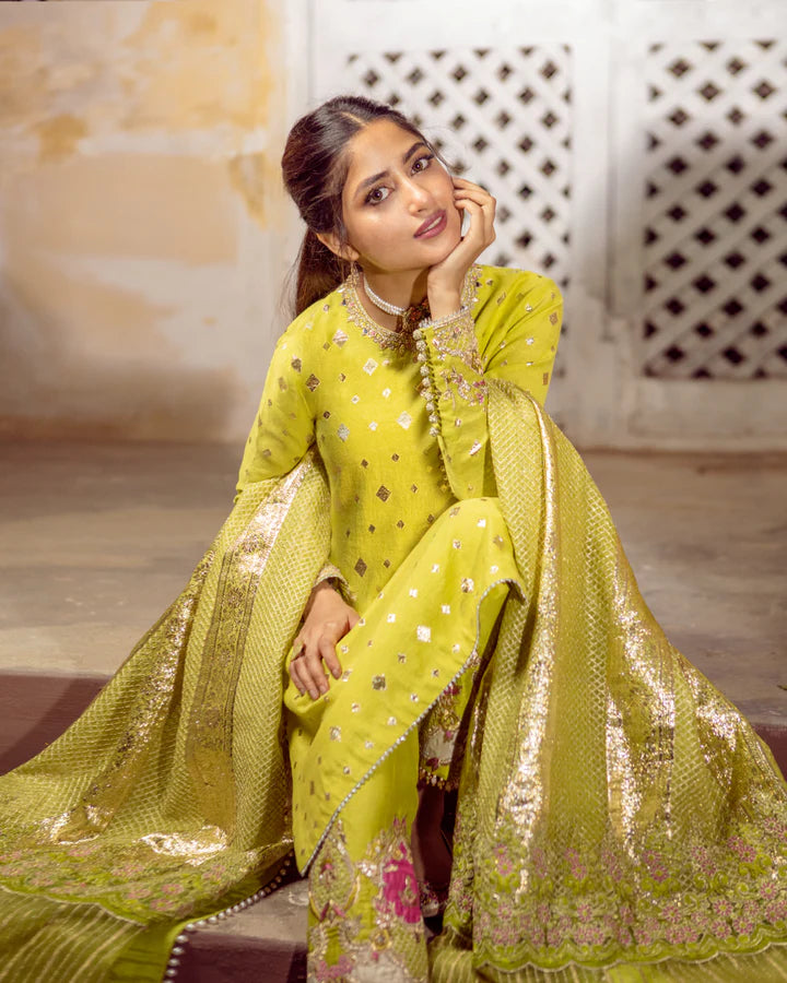 model wearing lime green dress by Faiza Saqlain, Pakistani luxury pret available online in UK for festive celebrations
