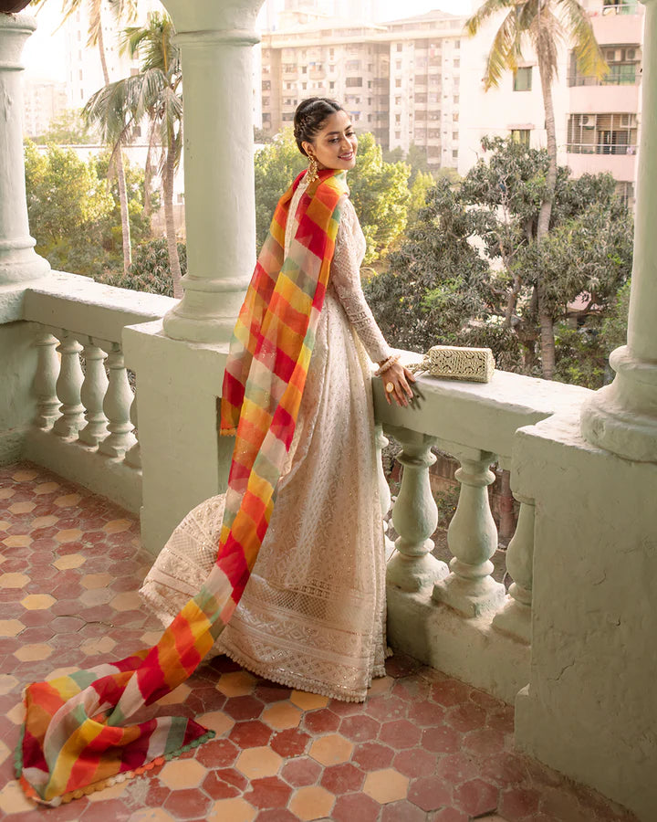 model wearing white dress with colorful dupatta by Faiza Saqlain, Pakistani luxury pret available online in UK