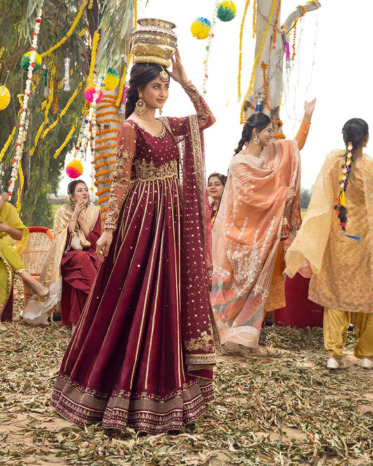 model wearing maroon dress by Faiza Saqlain, Pakistani luxury pret available online in UK for elegant festive wear