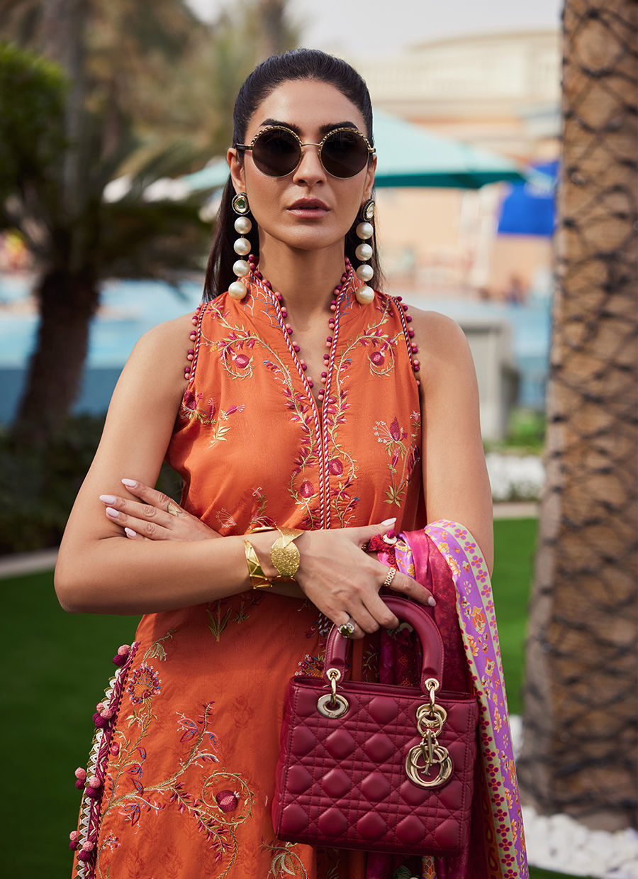 Model wearing rust orange embroidered outfit from Farah Talib Aziz, Unstitched Luxury '25, ideal for Pakistani clothes online in UK.