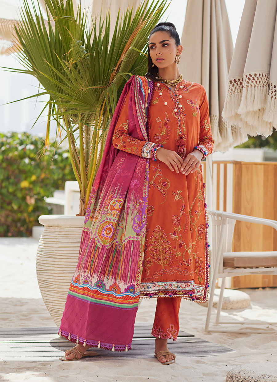 Model wearing rust orange embroidered outfit from Farah Talib Aziz, Unstitched Luxury '25, ideal for Pakistani clothes online in UK.