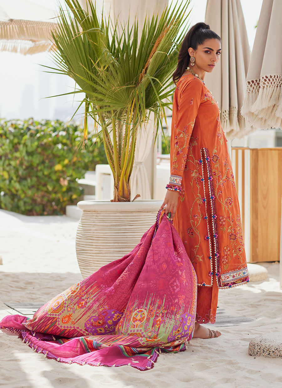 Model wearing rust orange embroidered outfit from Farah Talib Aziz, Unstitched Luxury '25, ideal for Pakistani clothes online in UK.