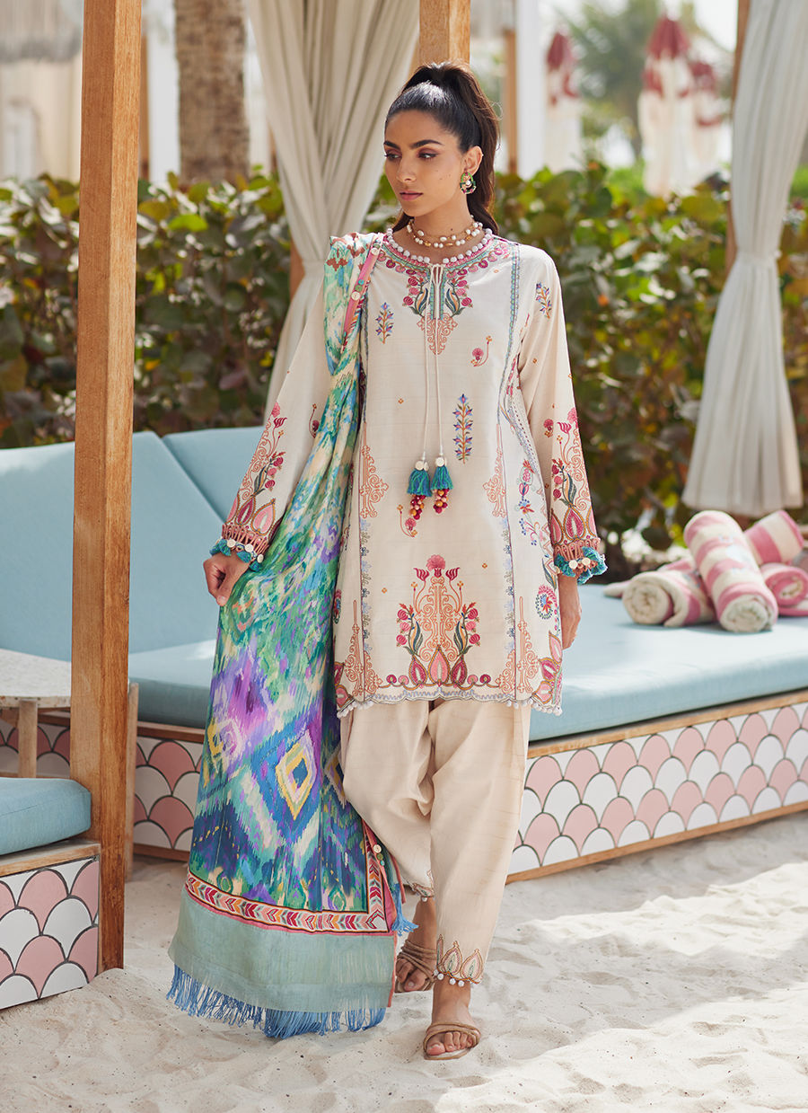 Model wearing ivory embroidered dress with multicolor printed dupatta from Farah Talib Aziz Irene Ivory, Pakistani clothes online in UK.