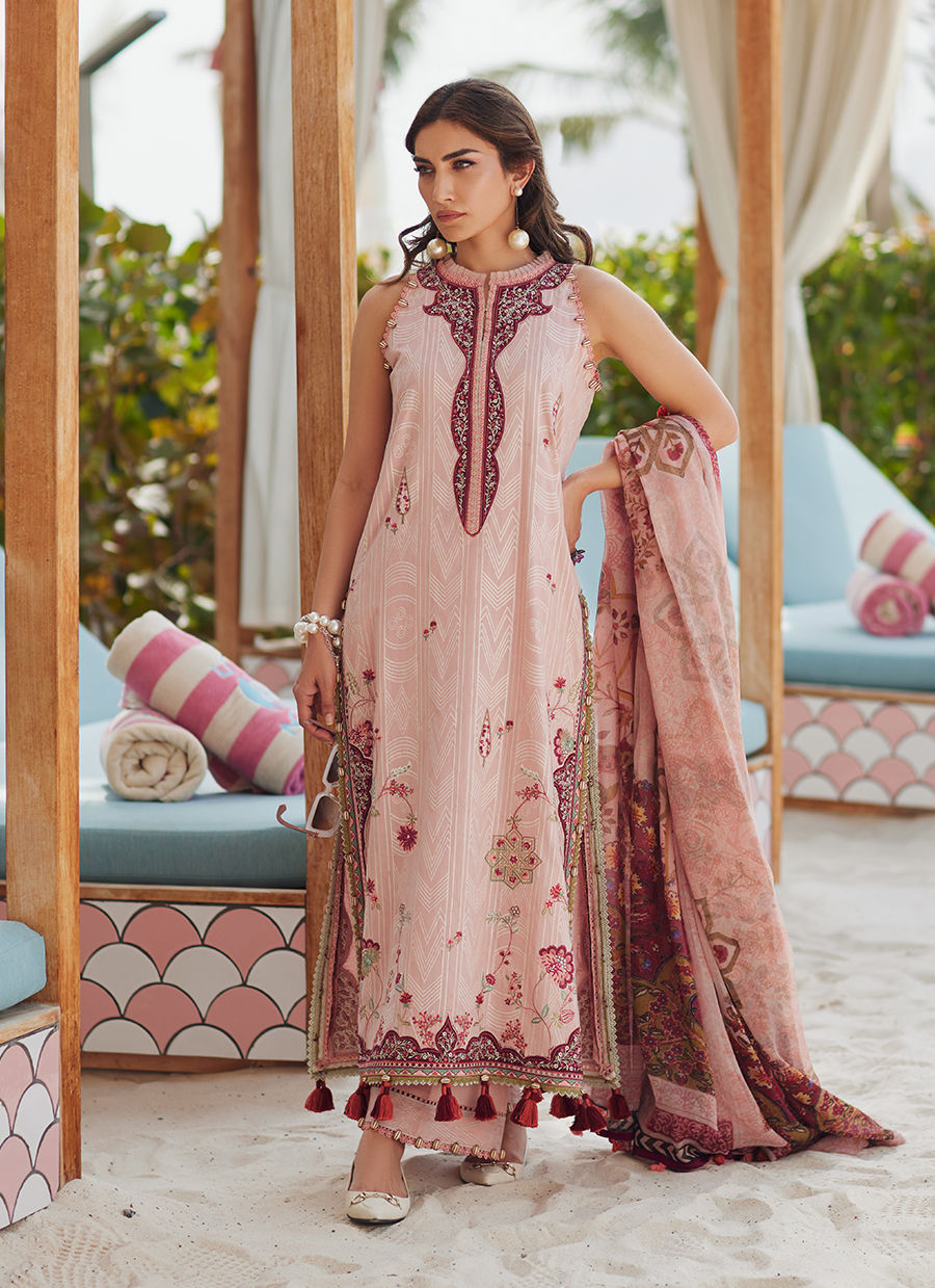 Model wearing tea pink embroidered dress with tassel detailing from Farah Talib Aziz Pricsilla, Pakistani Luxury pret in UK.