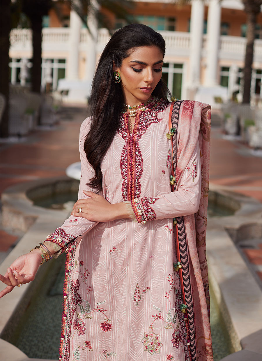 Model wearing tea pink embroidered dress with tassel detailing from Farah Talib Aziz Pricsilla, Pakistani Luxury pret in UK.